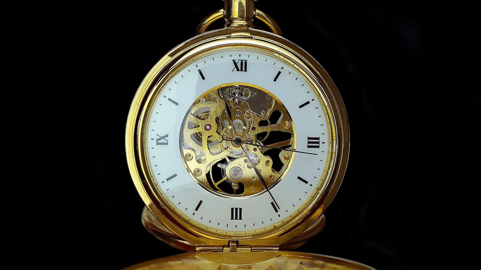 The exposed movement of a mechanical pocket watch.